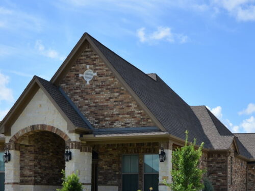 close up of a houses new shingle roof after roof replacement service buckeye az